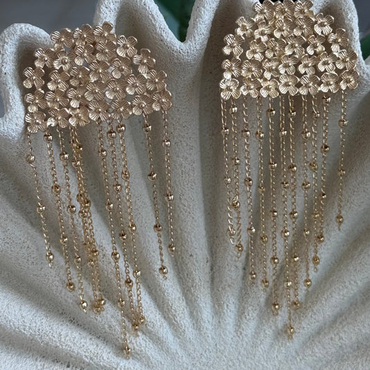 aros largos flor baño oro