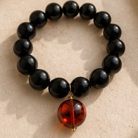 Pulsera de Resina Italiana Negra con Esfera Ámbar