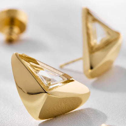 Aros Dualis dorados con ónix negro, diseño tipo botón moderno
Aros Dualis plateados con cuarzo cristal, estilo elegante y contemporáneo
