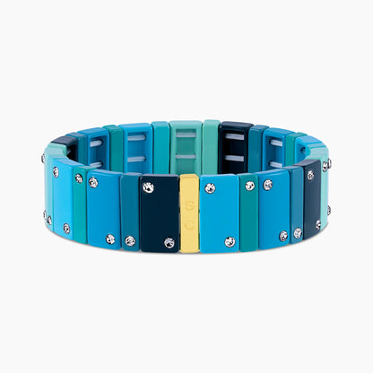 Pulsera Dominó Luxe Mist ancha en tonos menta, aqua, turquesa y azul oscuro con cristales.