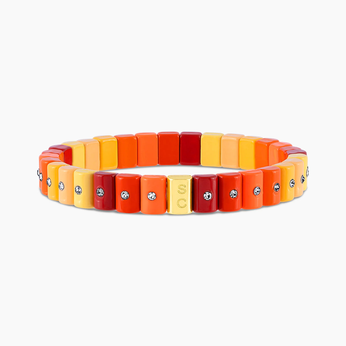 Pulsera Dominó Mini Citrus en amarillo, naranja y rojo con pequeños cristales.